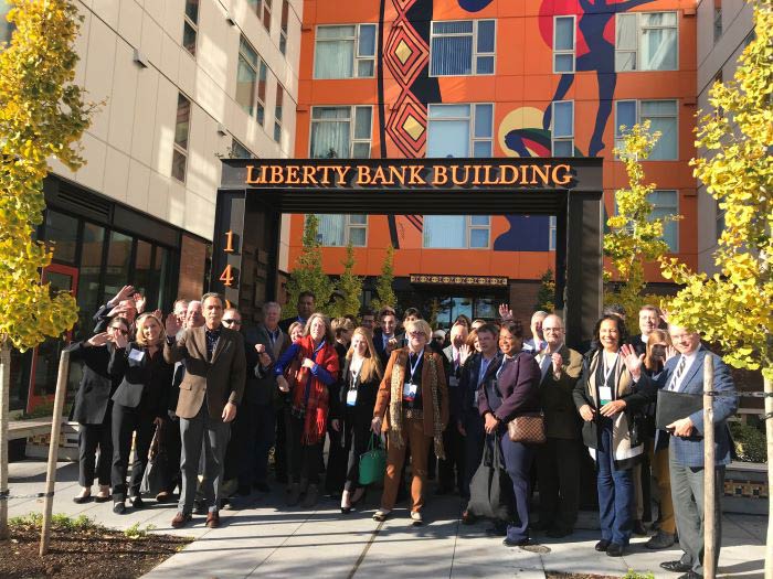 Group photo outside Liberty Bank Building